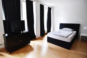 Ein Bett oder Betten in einem Zimmer der Unterkunft Dorya am Ring