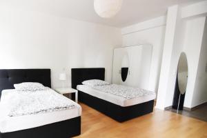 Ein Bett oder Betten in einem Zimmer der Unterkunft Dorya am Ring