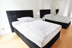 Ein Bett oder Betten in einem Zimmer der Unterkunft Dorya am Ring