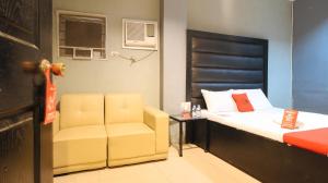 a small room with a bed and a chair at RedDoorz @ P Florentino Street Sampaloc Manila in Manila +21 photos