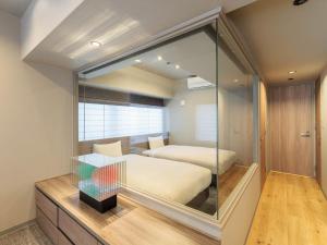 a bedroom with a bed and a large mirror at Minn Kiyomizu Gojo in Kyoto