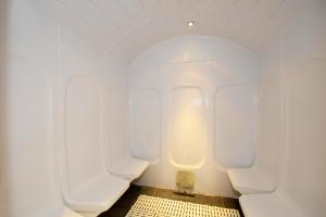 a bathroom with two urinals in a room at Résidence Odalys Les Balcons d'Auréa in Auris
