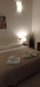 Postel nebo postele na pokoji v ubytování Hotel IL Rifugio