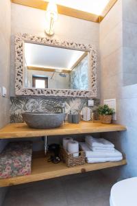 a bathroom with a sink and a mirror at Villa Eliyas with Jacuzzi near the Pirin Golf Resort in Razlog +37 photos