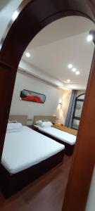 a room with two beds on a boat at Kaibu Courtyard Superior Apartment, Changjiang Cable Car Nanbin Road, Chongqing in Chongqing