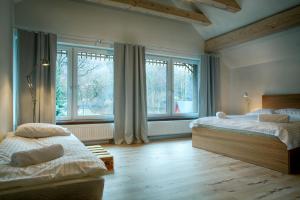 Posteľ alebo postele v izbe v ubytovaní Apartamenty Odlot