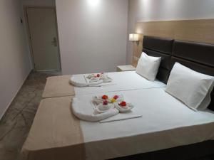 Postel nebo postele na pokoji v ubytování Rachoni Resort