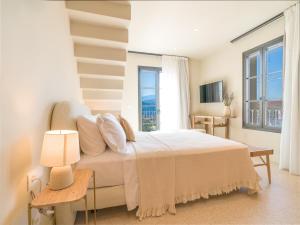 Voodi või voodid majutusasutuse Argostoli Essence Suites toas +37 fotot