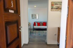 a hallway leading to a living room with a couch at Guest House Malusha in Gabrovo