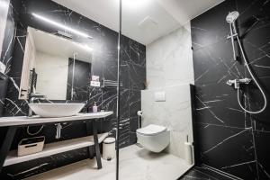 Koupelna v ubytování Hotel Litovel + 37 fotografií