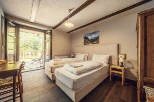 Giường trong phòng chung tại Albergo Locanda Mistral