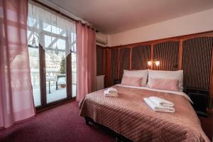 Postel nebo postele na pokoji v ubytování Hotel Litovel