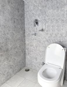 Koupelna v ubytování Xanadu Homes + 6 fotografií