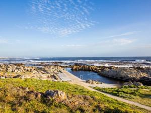 a view of the ocean from a bluff at Two Palm House - Vermont Hermanus in Hermanus