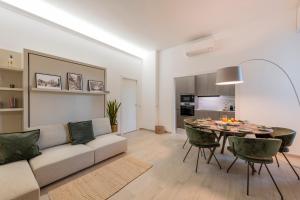 a living room with a couch and a table at Argonne 51 Spazio Argonne studio apartment in Milan