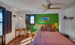 Ένα ή περισσότερα κρεβάτια σε δωμάτιο στο Casa Rural Arroyo de la Greda