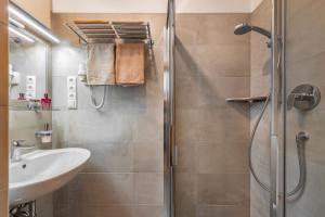 a bathroom with a shower and a sink at Austillerhof - Urlaub auf dem Bauernhof in Funes +63 photos