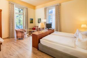 Ένα ή περισσότερα κρεβάτια σε δωμάτιο στο Hotel Tannenhof +56 φωτογραφίες