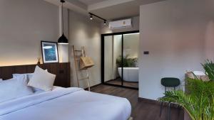 Voodi või voodid majutusasutuse Suncloud Hotel Koh Samet toas