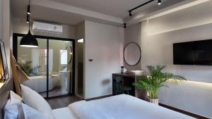 Voodi või voodid majutusasutuse Suncloud Hotel Koh Samet toas