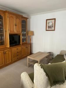 a living room with a couch and a table at Casa Carmen in Candeleda