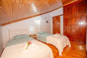 Postel nebo postele na pokoji v ubytování Villa Eleni Peritheia BY CorfuEscapes