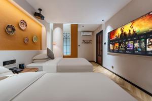 TV a/nebo společenská místnost v ubytování Chaozhou Fanhuali B&B
