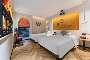 Rúm í herbergi á Chaozhou Fanhuali B&B