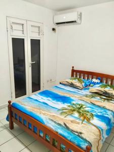 Postel nebo postele na pokoji v ubytování Appartement Anse-MitanTrois-Îlets, proche plage et loisirs