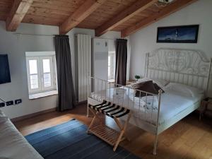 a bedroom with a bed and a glass table at Piazza Grande City Residence in Trieste
