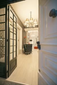 a hallway with a door leading to a dining room at Sliema Central Iprime Suites in Sliema