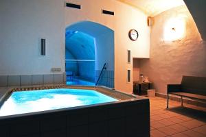 a large swimming pool in a building with at Chateau GrandCastle in Liptovský Hrádok