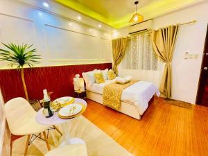 a hotel room with a bed and a table and a tableablish at Subway House in Paranaque in Manila