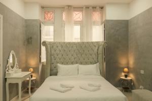Postel nebo postele na pokoji v ubytování Sliema Central Iprime Suites