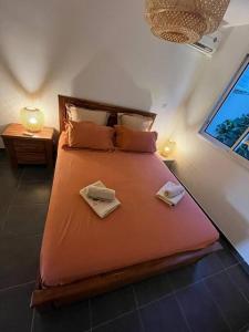 Postel nebo postele na pokoji v ubytování Appt Corail au pied du Lagon St Leu - 6 pers