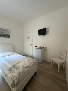 Postel nebo postele na pokoji v ubytování Albergo del Pozzo