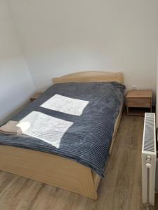 Postel nebo postele na pokoji v ubytování MM-2 Apartman