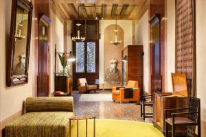 a living room with a couch and some chairs at Ca' Pisani Hotel in Venice