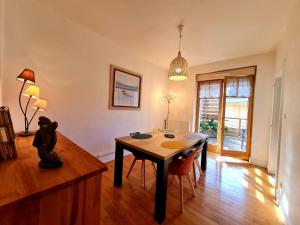 a living room with a table and a teddy bear sitting on a table at Bel appart au centre avec terrasse et parking - FR-1-589-674 in Gérardmer