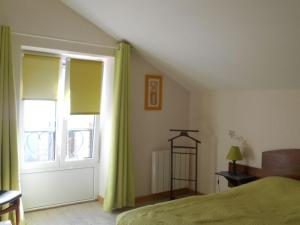 a bedroom with a bed and a large window at Gîte en Lorraine : 3 ch, jardin, proche Lac de Madine - FR-1-584-335 in Saint-Baussant +11 photos