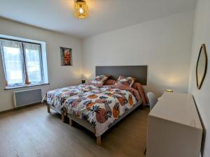 a bedroom with a bed and a window at Gîte rénové avec parking à proximité de Saint-Dié-des-Vosges - FR-1-589-675 in Saint-Michel-sur-Meurthe