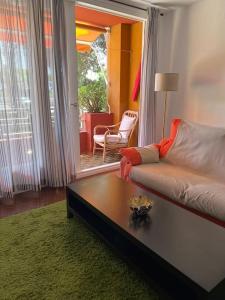a living room with a couch and a coffee table at Cozy apartment close to the beach for 2 persons in Gavà