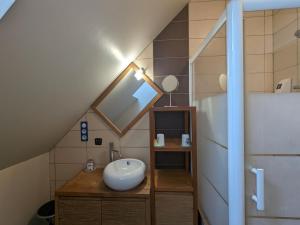 a bathroom with a sink in a attic at Maison spacieuse et contemporaine avec parking, vélos et baby-foot en Berry - FR-1-591-649 in Neuvy-Saint-Sépulchre +26 photos