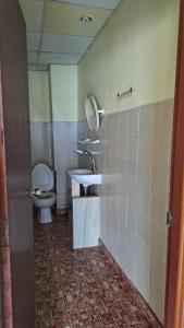 a bathroom with a sink and a toilet at Jomtien nighttrip hous in Jomtien Beach +11 photos