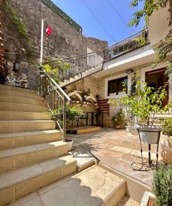a stone building with stairs and a stair case at Vita Mundo in Kotor
