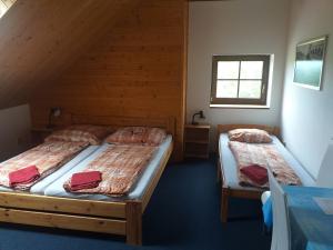 Postel nebo postele na pokoji v ubytování Penzion Na Majlantě