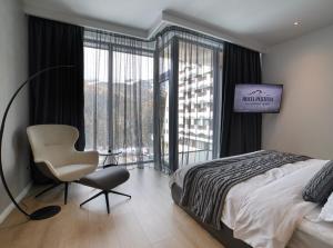 Postel nebo postele na pokoji v ubytování Hotel Pestera Wellness & Spa + 37 fotografií