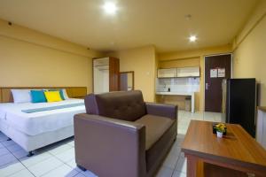 Kuchyň nebo kuchyňský kout v ubytování Apartemen Mutiara Bekasi By Abdihome