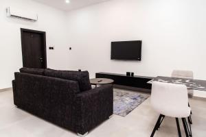 TV a/nebo společenská místnost v ubytování The Kottage 3Br Apartment