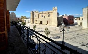 a view of a building from a balcony at Al Castello Dimora in un Borgo Medioevale 10 posti in Torricella